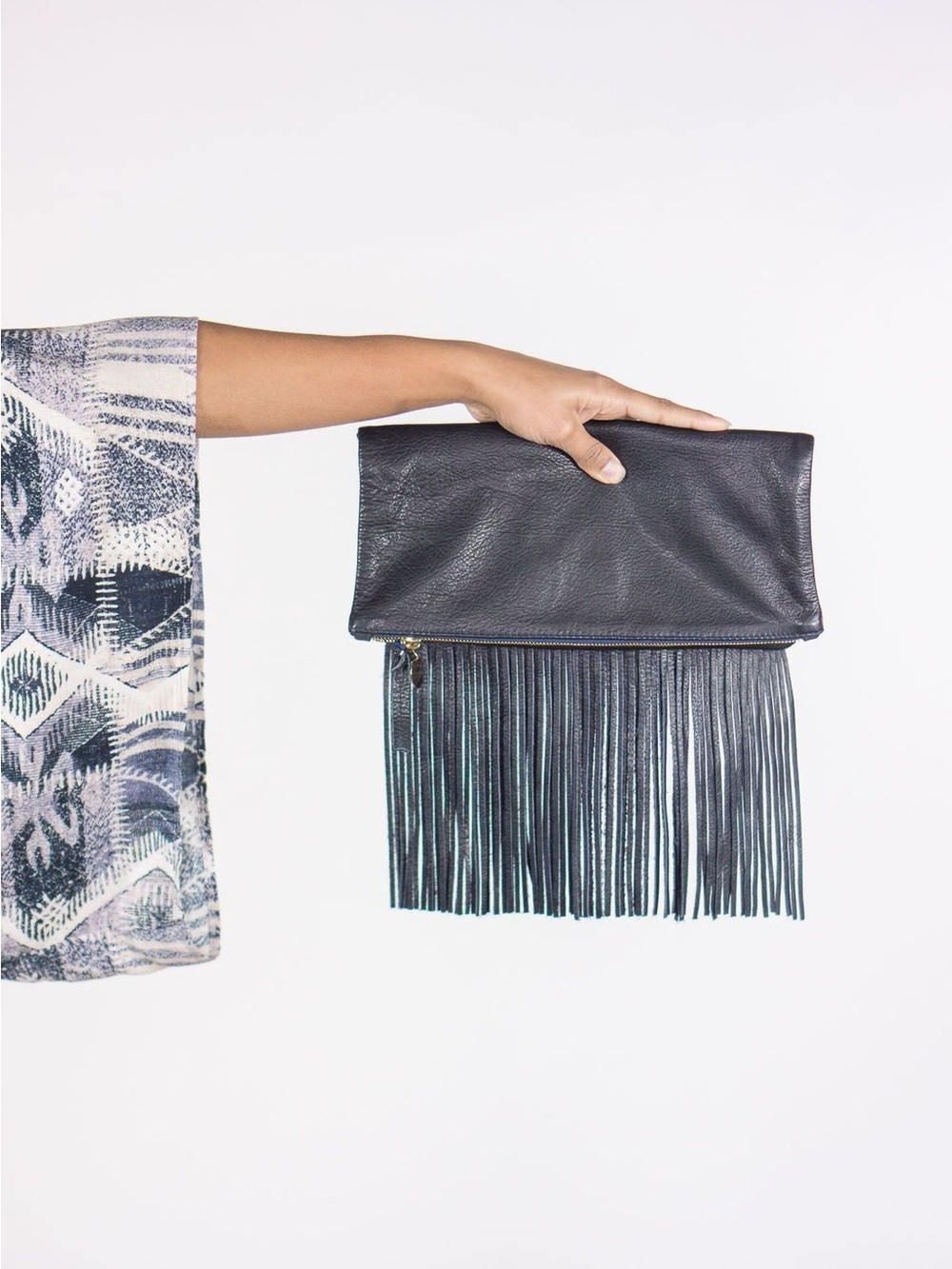 CLARE V. FRINGE FOLDOVER LEATHER CLUTCH